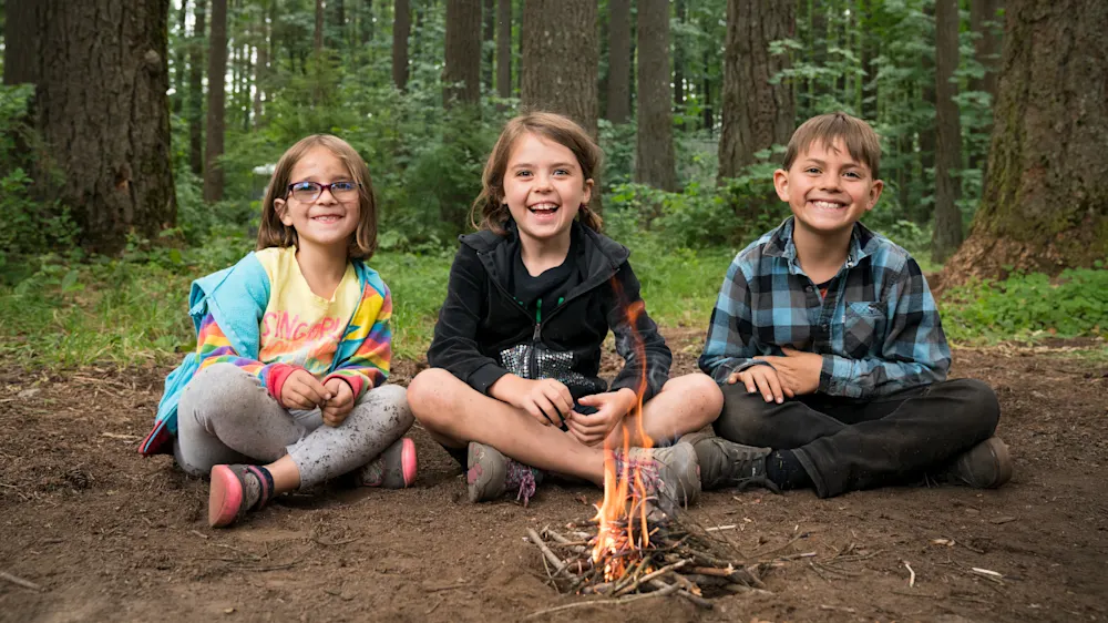 Campers learning wilderness survival skills