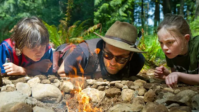 Campers learning real fire skills