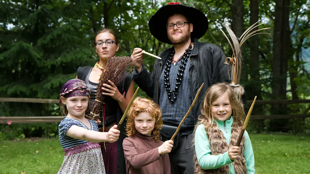 School of Magic campers with wands in the forest